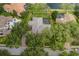 Aerial shot of the property showing the house, pool, and surrounding landscape near the water at 10531 Pontofino Cir, Trinity, FL 34655