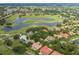 Aerial view of the community and golf course highlighting the location in a golf community with ponds and greenery at 10531 Pontofino Cir, Trinity, FL 34655