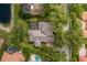 An aerial view of property showing a tile roof and an enclosed backyard pool at 10531 Pontofino Cir, Trinity, FL 34655