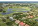 Aerial view of Fox Hollow Golf Club & Restaurant showcasing nearby community, golf and water features at 10531 Pontofino Cir, Trinity, FL 34655