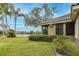 Scenic backyard view featuring a serene lake with a fountain at 10531 Pontofino Cir, Trinity, FL 34655