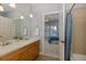 Bathroom featuring a double sink vanity and a shower/tub combo at 10531 Pontofino Cir, Trinity, FL 34655