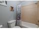 Clean bathroom with a bathtub and decorative shower curtain at 10531 Pontofino Cir, Trinity, FL 34655
