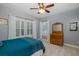 Inviting bedroom with natural light, ceiling fan, and traditional decor at 10531 Pontofino Cir, Trinity, FL 34655