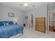 Light bedroom featuring a dresser and ensuite bathroom at 10531 Pontofino Cir, Trinity, FL 34655