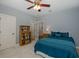 Comfortable bedroom with a ceiling fan and neutral-toned walls at 10531 Pontofino Cir, Trinity, FL 34655