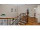 Elegant foyer with wood floors and decorative iron railing at 10531 Pontofino Cir, Trinity, FL 34655