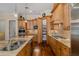 Gourmet kitchen with walk-in pantry, stainless appliances, and granite countertops at 10531 Pontofino Cir, Trinity, FL 34655