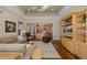 Open living room with wood floors that flows into the kitchen, creating a warm and inviting atmosphere at 10531 Pontofino Cir, Trinity, FL 34655