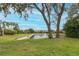 Scenic view of a community pond with a fountain and surrounding homes at 10531 Pontofino Cir, Trinity, FL 34655