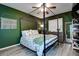 Bedroom with a canopy bed, dark green walls, and light-colored flooring at 10670 43Rd N St # 204, Clearwater, FL 33762