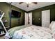 Comfortable bedroom featuring a TV, ceiling fan, and natural light at 10670 43Rd N St # 204, Clearwater, FL 33762