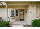 Inviting entrance with flower box and a well-kept walkway leading to the front door at 10670 43Rd N St # 204, Clearwater, FL 33762