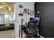 Functional home office with a black desk, comfortable chair, and view of the outdoors at 10670 43Rd N St # 204, Clearwater, FL 33762