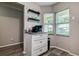 Coffee bar with granite countertops, white cabinets, and a bright window at 10670 43Rd N St # 204, Clearwater, FL 33762