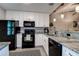 Bright kitchen with white cabinets, granite countertops and stainless steel appliances at 10670 43Rd N St # 204, Clearwater, FL 33762