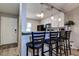 Modern kitchen featuring a breakfast bar with pendant lighting and stainless steel appliances at 10670 43Rd N St # 204, Clearwater, FL 33762