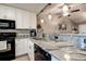 Bright and airy kitchen with stainless steel appliances, white cabinets, and modern fixtures at 10670 43Rd N St # 204, Clearwater, FL 33762