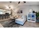 Bright living room featuring a sectional sofa, modern decor, and an open floor plan with kitchen at 10670 43Rd N St # 204, Clearwater, FL 33762