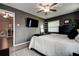Main bedroom with a neutral wall, tv, and a large window at 10670 43Rd N St # 204, Clearwater, FL 33762