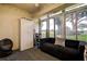 Sun room with large windows, comfortable seating, and view of the backyard at 10670 43Rd N St # 204, Clearwater, FL 33762