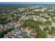Expansive aerial view of a residential neighborhood with tree-lined streets and well-maintained homes in a suburban setting at 11404 Inman Ct, Spring Hill, FL 34609