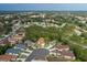 Aerial view of the Wellington community, showcasing the neighborhood, trees, clubhouse, and amenities at 11404 Inman Ct, Spring Hill, FL 34609