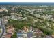 Overhead shot showcasing a tranquil residential area with neatly arranged homes, lush greenery and cul-de-sac street design at 11404 Inman Ct, Spring Hill, FL 34609