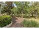 Spacious backyard with mature trees and lush landscaping at 11404 Inman Ct, Spring Hill, FL 34609