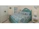 Cozy bedroom showcasing a decorative bed frame, matching linens and natural light at 11404 Inman Ct, Spring Hill, FL 34609