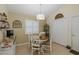 Cozy breakfast nook with tile floors, a round table, and shuttered windows at 11404 Inman Ct, Spring Hill, FL 34609
