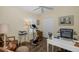 Well-lit exercise room with bike, desk, hardwood floors, and closet at 11404 Inman Ct, Spring Hill, FL 34609
