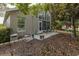 Exterior view of a home with a patio and a well-maintained backyard at 11404 Inman Ct, Spring Hill, FL 34609