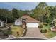 Inviting single-story home with brick paver driveway and lush landscaping at 11404 Inman Ct, Spring Hill, FL 34609