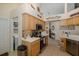 Spacious kitchen with a stainless steel oven, tile backsplash, and ample counter space at 11404 Inman Ct, Spring Hill, FL 34609