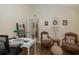 Comfortable office with hardwood floors, desk, chairs, and natural light at 11404 Inman Ct, Spring Hill, FL 34609