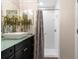 Bright bathroom showcasing a sleek vanity with vessel sink, walk-in shower, and contemporary design at 1142 Wolford Dr, Trinity, FL 34655