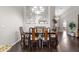 Formal dining room featuring hardwood floors, a large mirror, and a dining table with chairs at 1142 Wolford Dr, Trinity, FL 34655