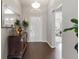Elegant foyer with hardwood floors, decorative mirror, and a view of the front door at 1142 Wolford Dr, Trinity, FL 34655