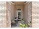 Cozy front porch area featuring a small table and chairs, ideal for enjoying the outdoors at 1142 Wolford Dr, Trinity, FL 34655