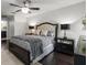 Comfortable main bedroom featuring a decorative ceiling fan and matching mirrored night stands at 1142 Wolford Dr, Trinity, FL 34655