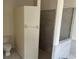 Modern bathroom features sleek shower, toilet and tile floors at 11520 Lounds Ct, New Port Richey, FL 34654
