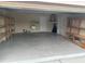 Spacious garage with shelving and plenty of room for storage and parking at 11520 Lounds Ct, New Port Richey, FL 34654