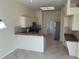 Open-concept kitchen with tile flooring and views of the adjacent rooms at 11520 Lounds Ct, New Port Richey, FL 34654