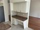 Kitchen desk area with ample storage and tile backsplash at 11520 Lounds Ct, New Port Richey, FL 34654