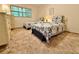 Cozy bedroom furnished with twin beds, soft carpet, and natural light, perfect for a restful retreat at 11733 Bayonet Ln, New Port Richey, FL 34654