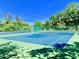 Get moving on this well-maintained tennis court surrounded by lush greenery and under a clear blue sky at 11733 Bayonet Ln, New Port Richey, FL 34654