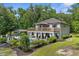 Aerial view of large backyard with pool, patio, detached structure, and lush, surrounding foliage at 12085 Stringer Rd, Brooksville, FL 34601