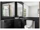 Modern bathroom with stylish mirror, sleek black fixtures, and a contemporary design at 12085 Stringer Rd, Brooksville, FL 34601