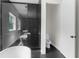 Bathroom featuring a glass shower, soaking tub, and sleek, modern fixtures at 12085 Stringer Rd, Brooksville, FL 34601